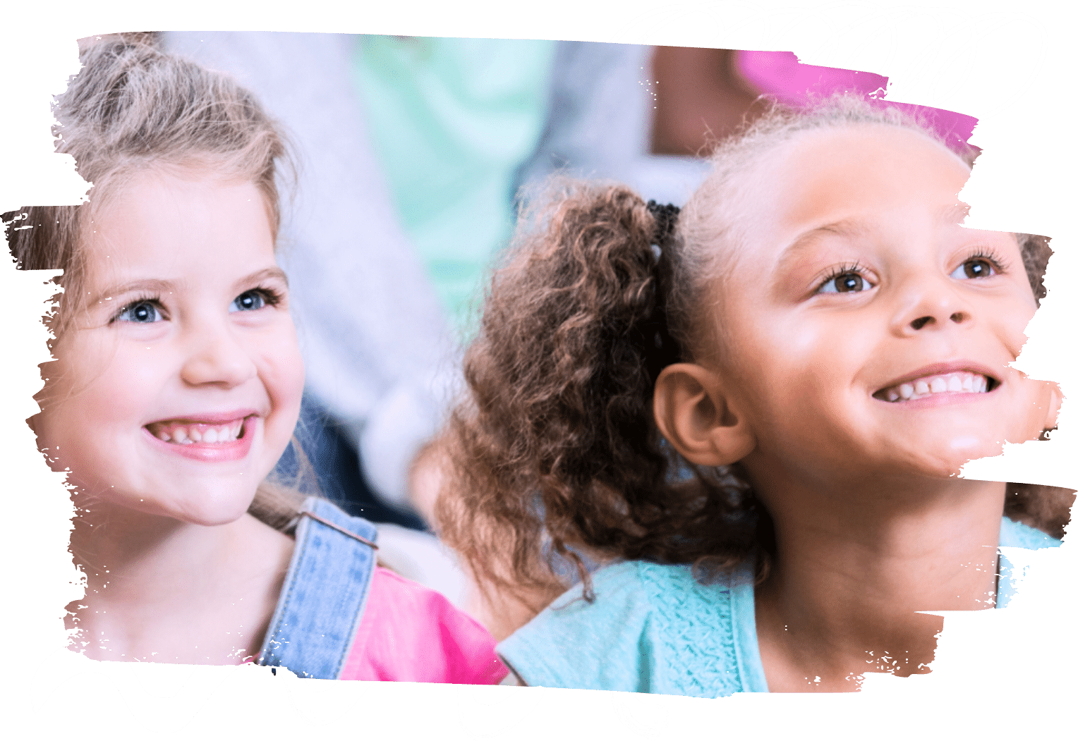 two young children looking up and smiling