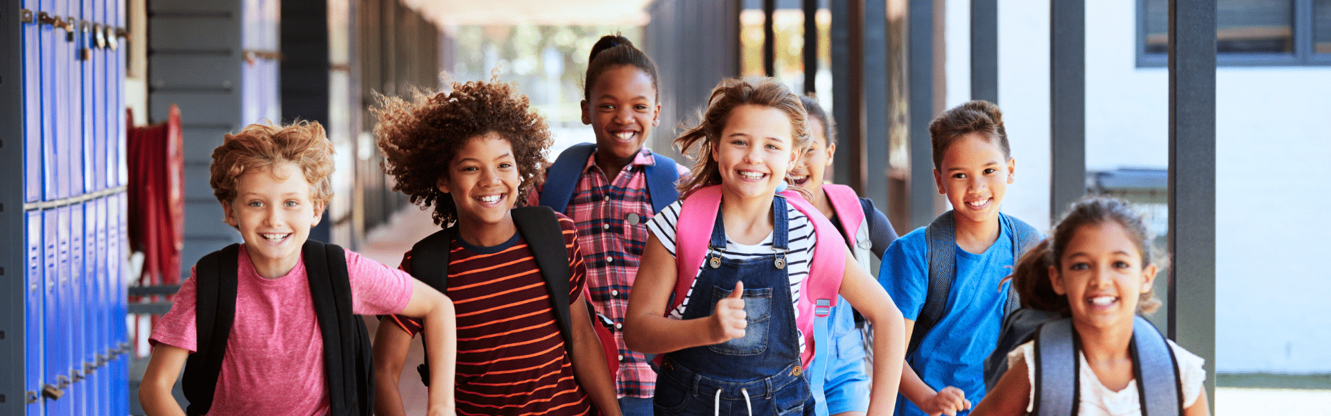 group of children running toward the camera, smiling group of children running toward the camera, smiling